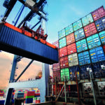 Container,Loading,In,A,Cargo,Freight,Ship,With,Industrial,Crane.